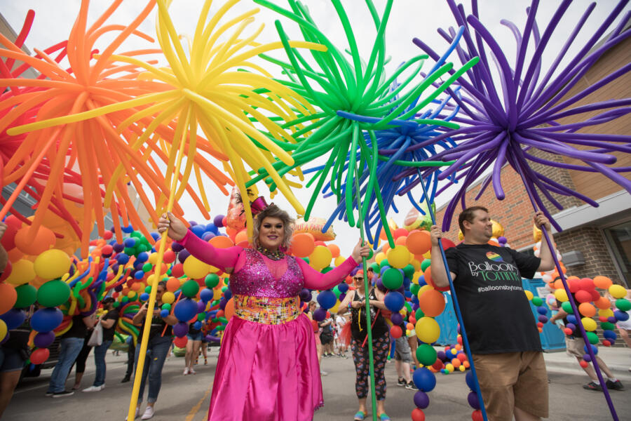 Parade performers celebrating LGBTQ+ pride in the streets of Northalsted in Chicago