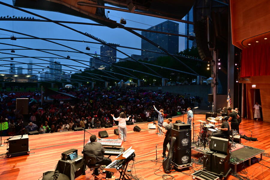 A performer at Chicago Gospel Music Festival looks out at the crowd in the evening