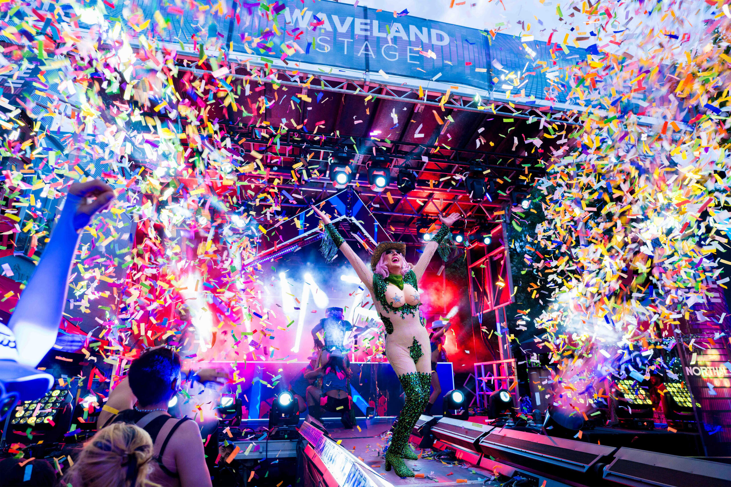 A performer surrounded by confetti at Chicago Pride Fest